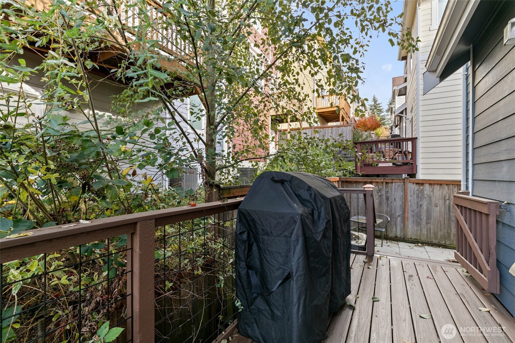 137 Maple Street Tacoma, WA 98466 - Photo 32 of 39 a view of a balcony with wooden floor and fence