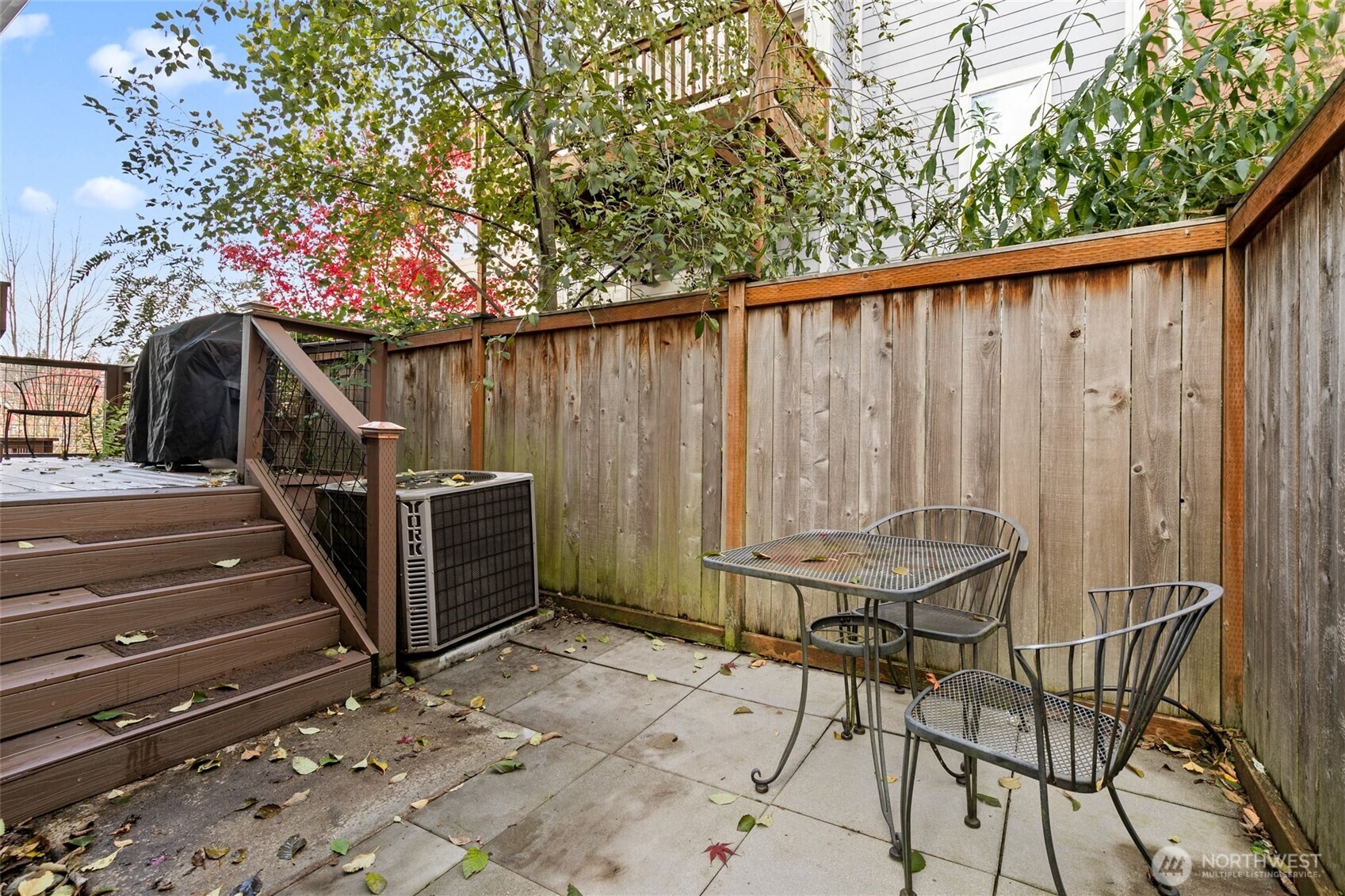 137 Maple Street Tacoma, WA 98466 - Photo 33 of 39 a view of a balcony with chairs and a stove