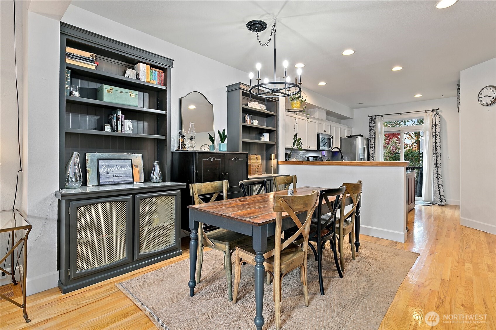 137 Maple Street Tacoma, WA 98466 - Photo 9 of 39 a view of a dining room with furniture and a book shelf