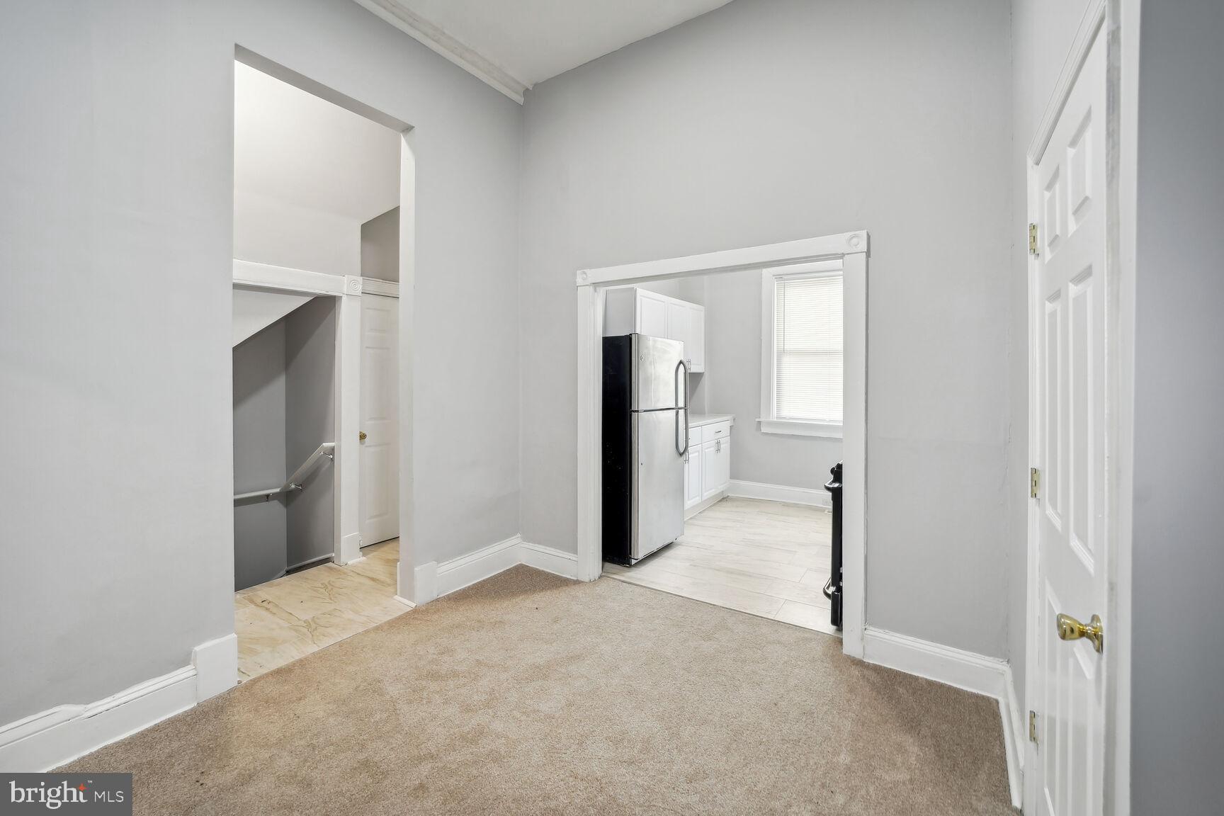 1909 McCulloh Street Baltimore, MD 21217 - Photo 11 of 22 a view of a room with a hallway and wooden floor