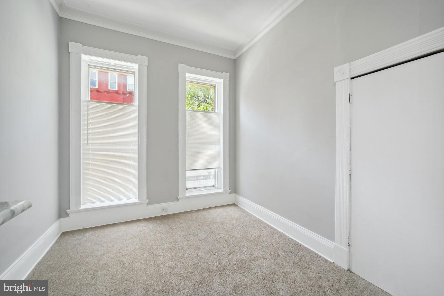 1909 McCulloh Street Baltimore, MD 21217 - Photo 13 of 22 an empty room with windows and closet