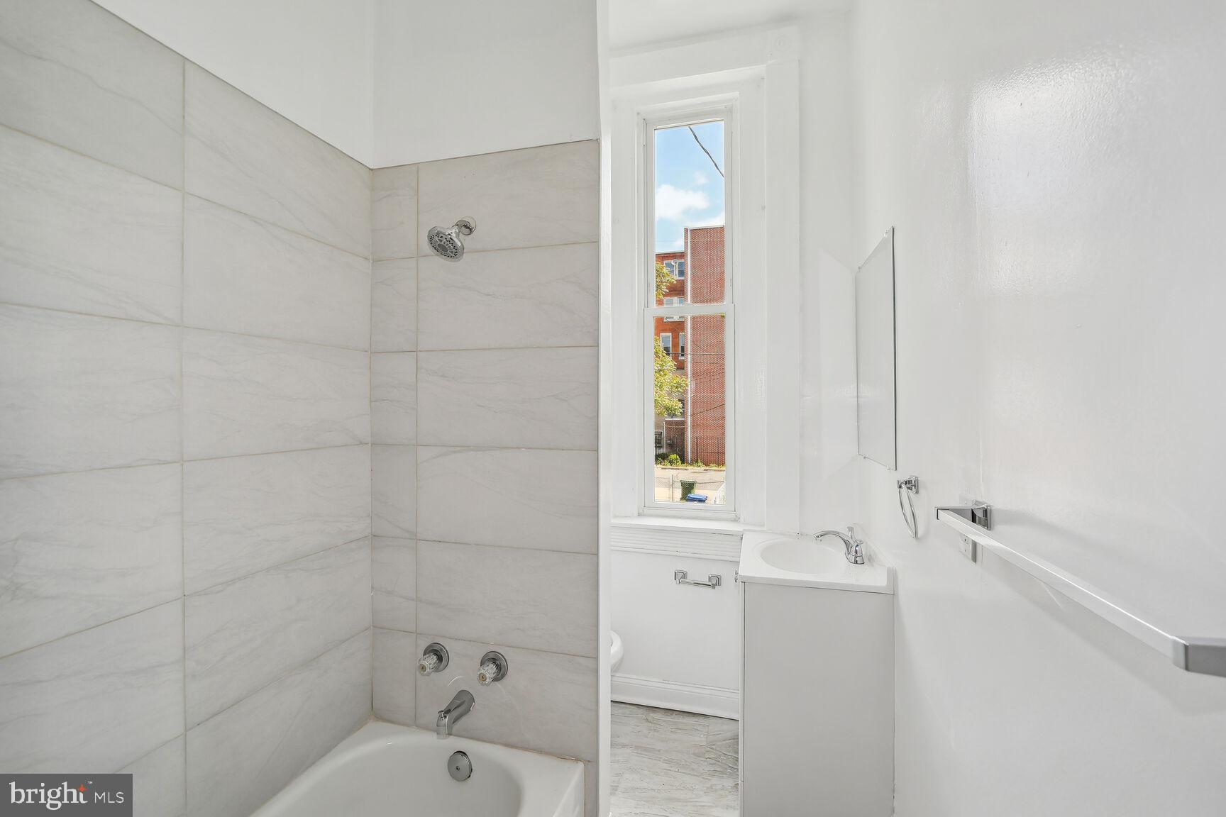 1909 McCulloh Street Baltimore, MD 21217 - Photo 20 of 22 a bathroom with a toilet and shower