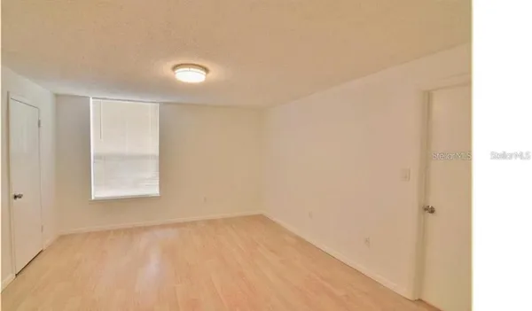 a view of an empty room and window