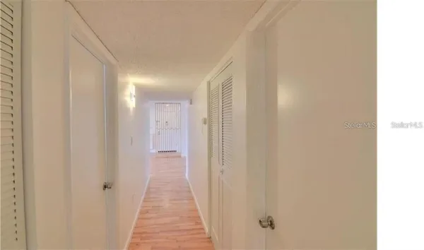 a view of a bathroom from the hallway