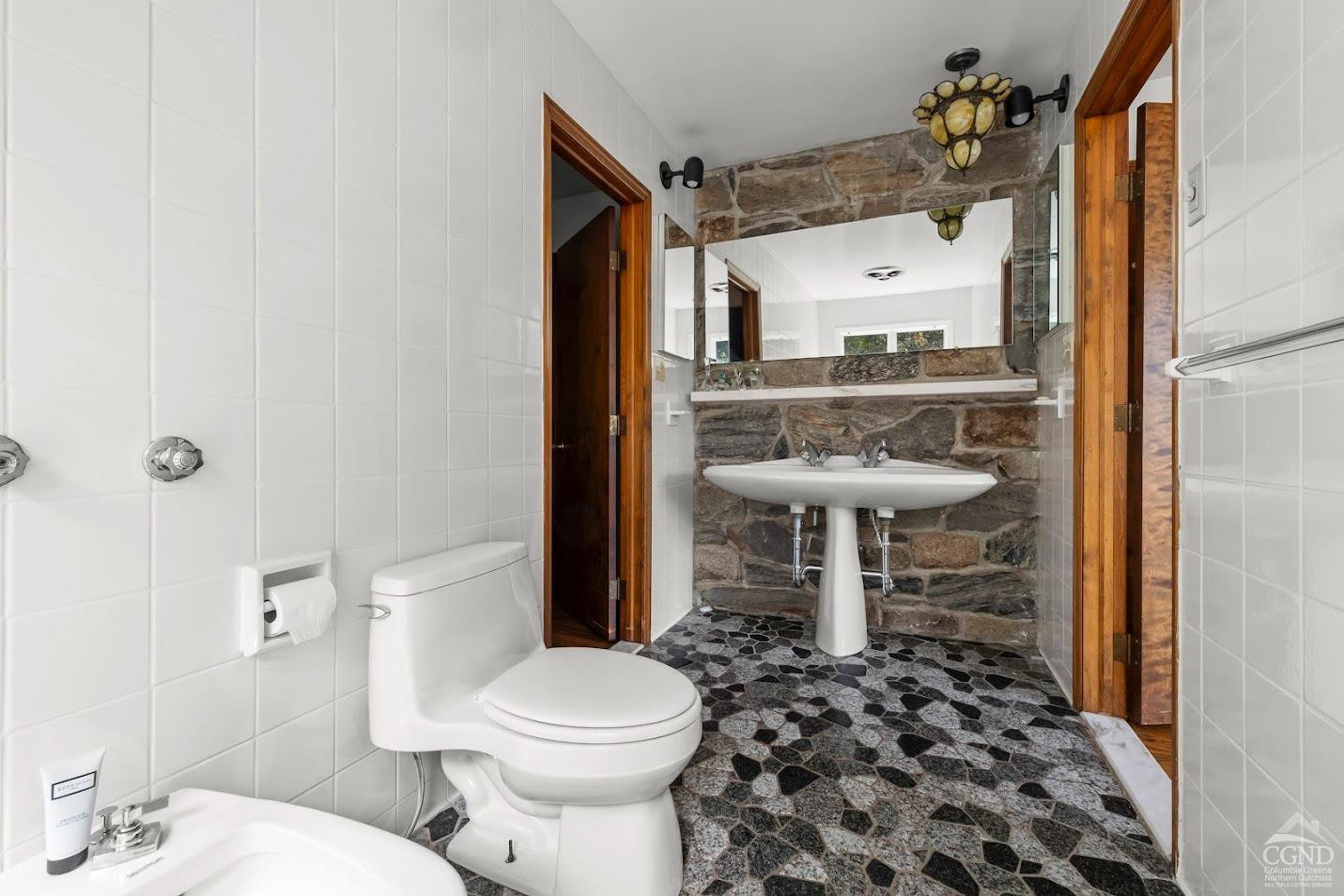 7951 Highway 22 Copake Falls, NY 12517 - Photo 22 of 40 a bathroom with a sink a toilet and shower