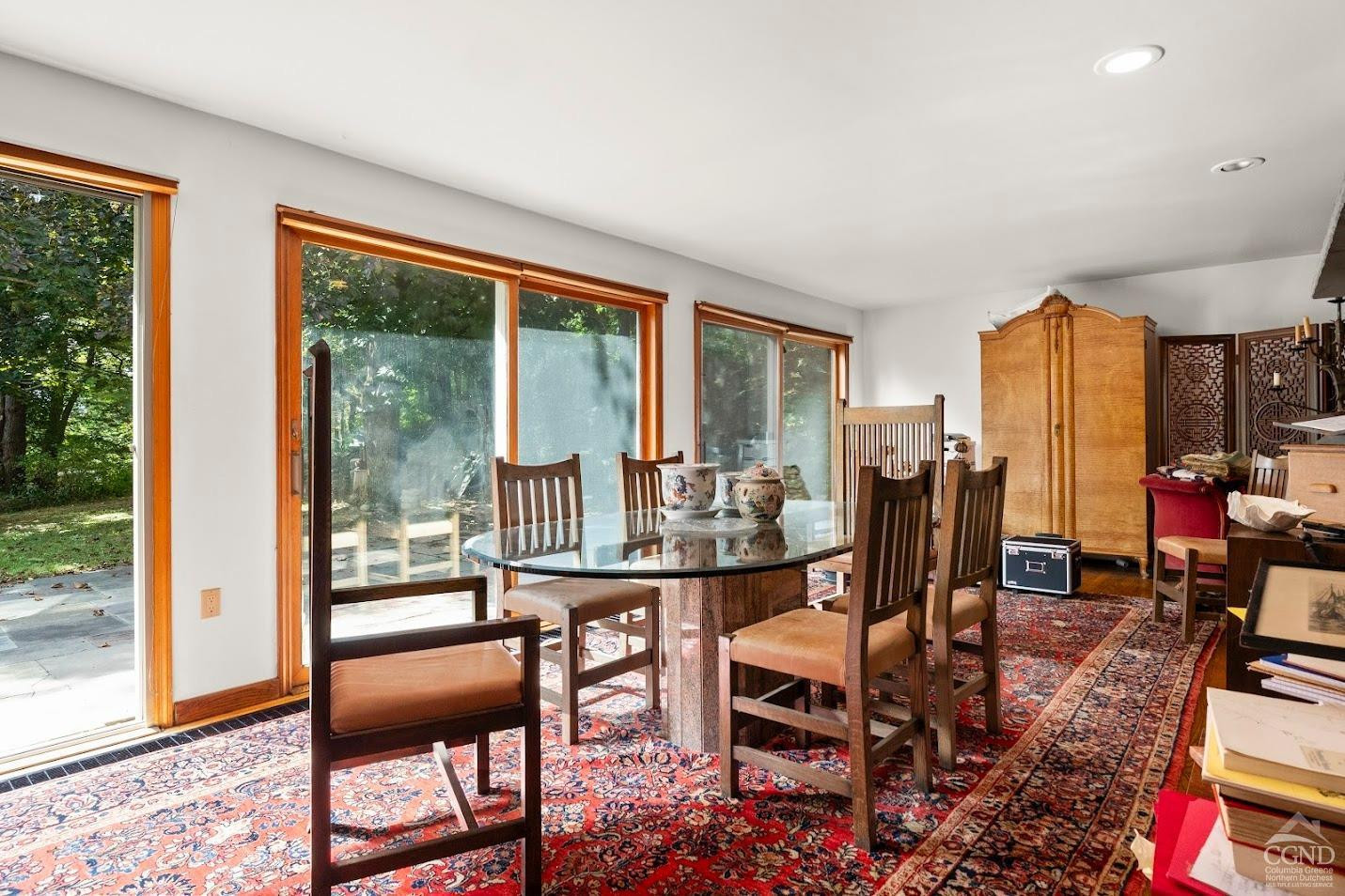 7951 Highway 22 Copake Falls, NY 12517 - Photo 8 of 40 a dining room with furniture water view and a floor to ceiling window