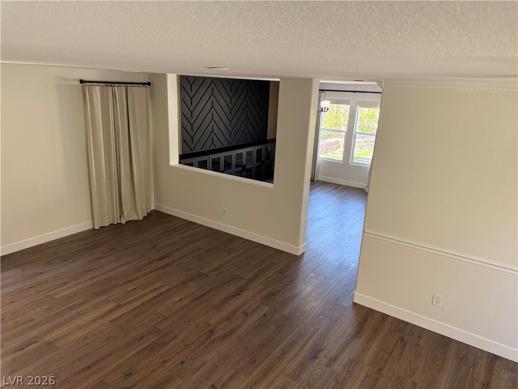 1141 Cathedral Ridge Street Henderson, NV 89052 - Photo 61 of 77 This versatile interior space offers rich hardwood flooring and abundant natural light.