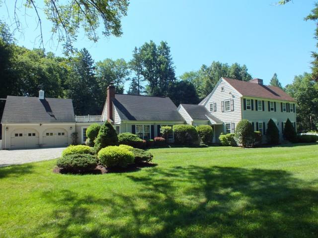 95 Evergreen Hill Road Fairfield, CT 06824 - Photo 1 of 1 a front view of a house with a garden