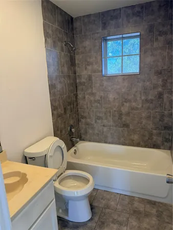 a bathroom with a sink a bathtub and a shower