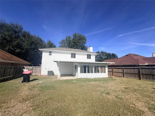 a house with trees in the background