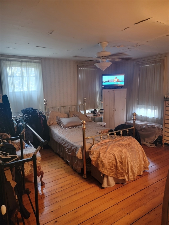 552 Main Street Medford, MA 02155 - Photo 11 of 11 a bedroom with double bed and a window