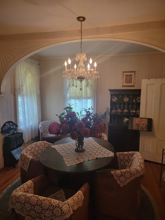 552 Main Street Medford, MA 02155 - Photo 9 of 11 a view of a dining room with furniture and chandelier