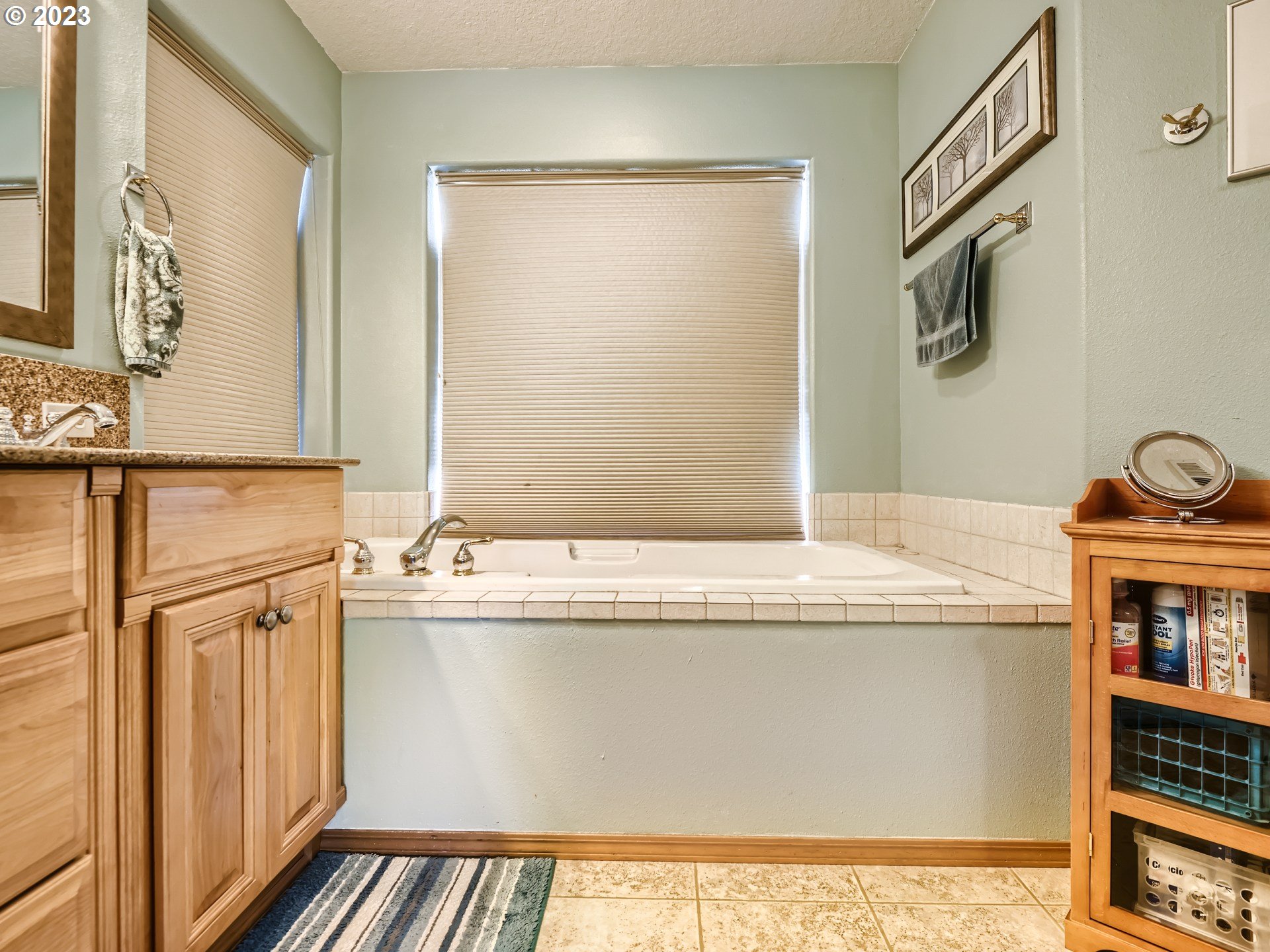 1167 Southeast Eagle Lane Gresham, OR 97080 - Photo 13 of 25 a bathroom with a granite countertop sink and a mirror