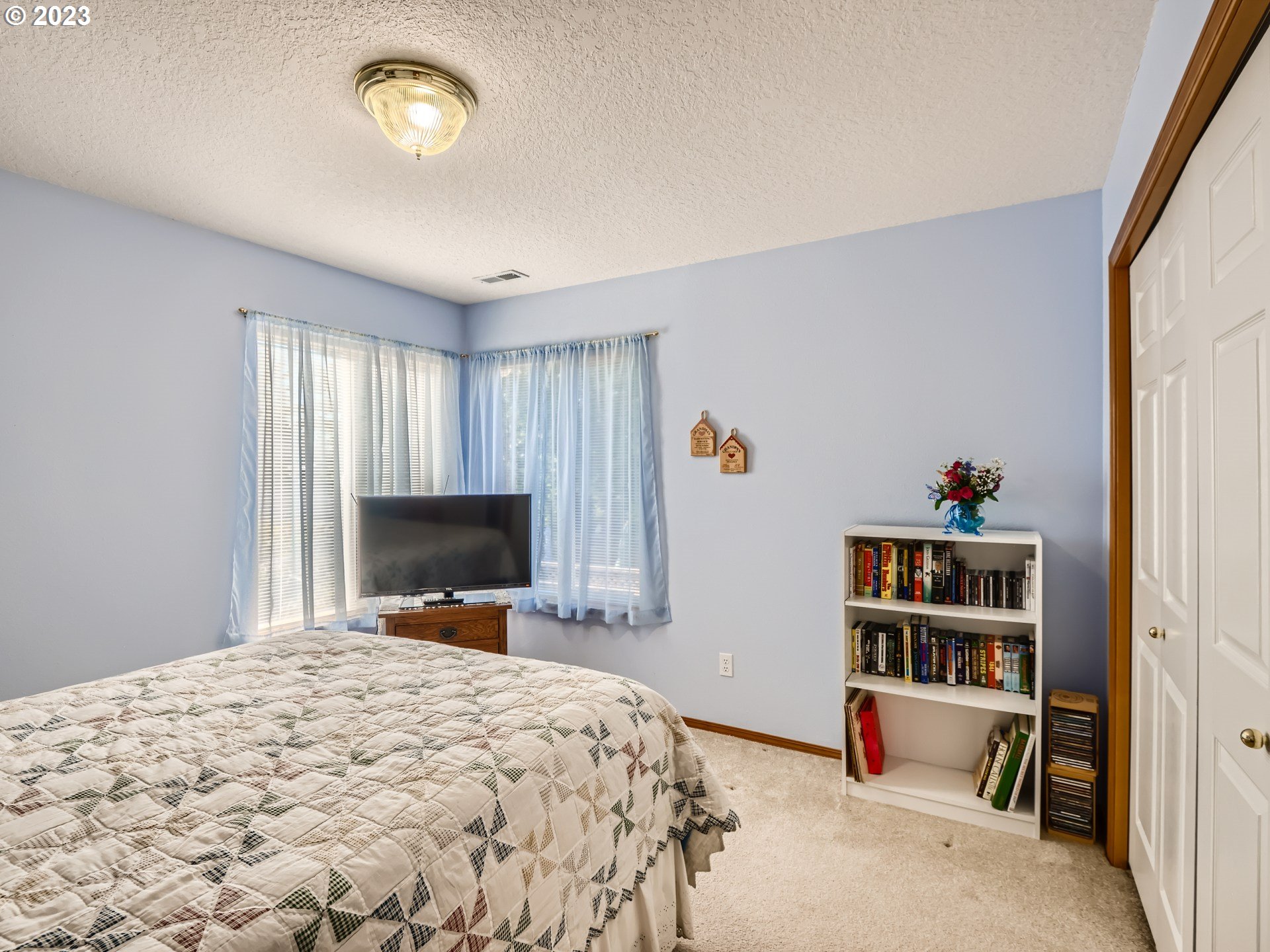 1167 Southeast Eagle Lane Gresham, OR 97080 - Photo 15 of 25 a bed room with a bed and a television