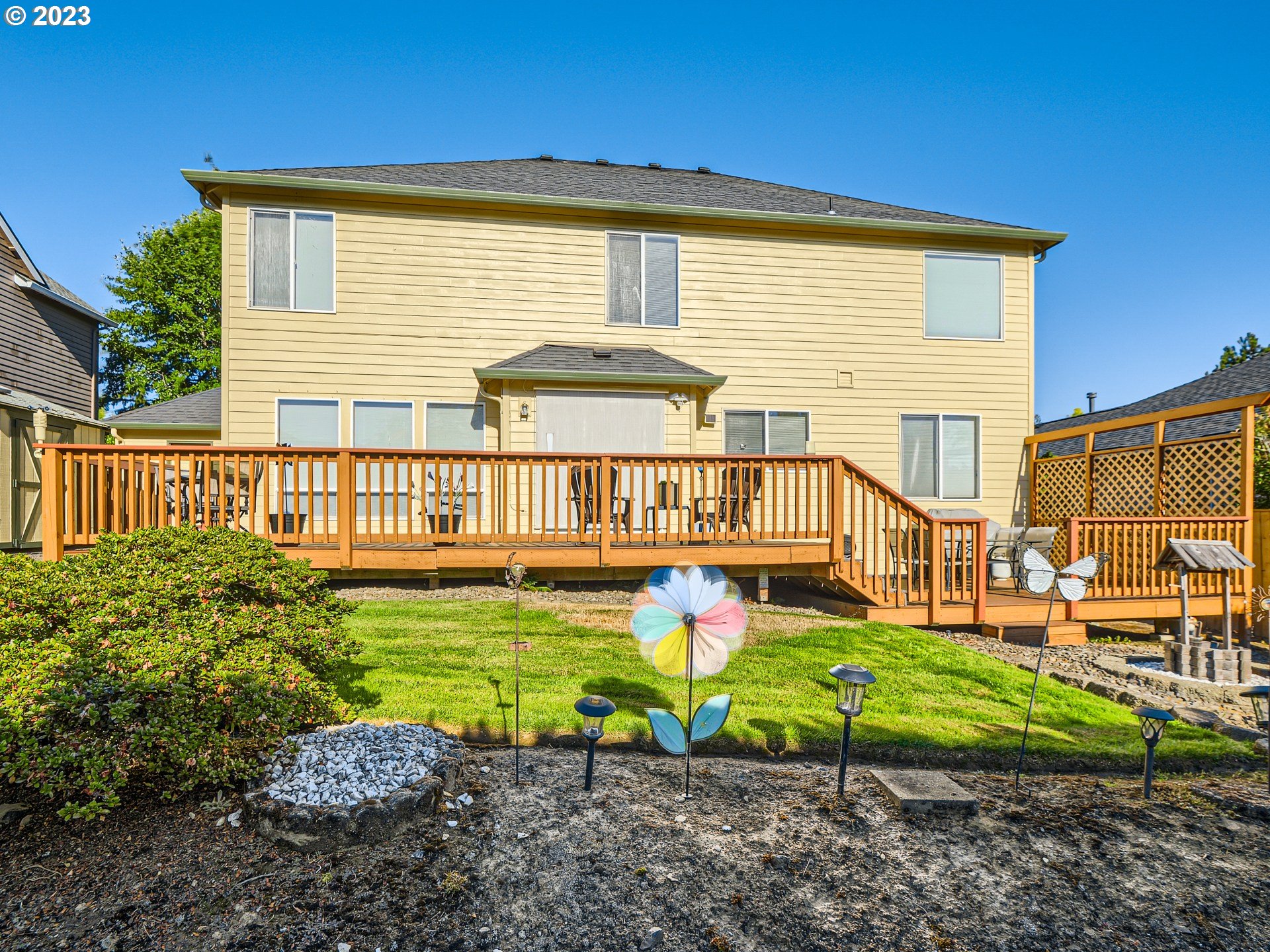 1167 Southeast Eagle Lane Gresham, OR 97080 - Photo 21 of 25 a view of a house with a yard and furniture