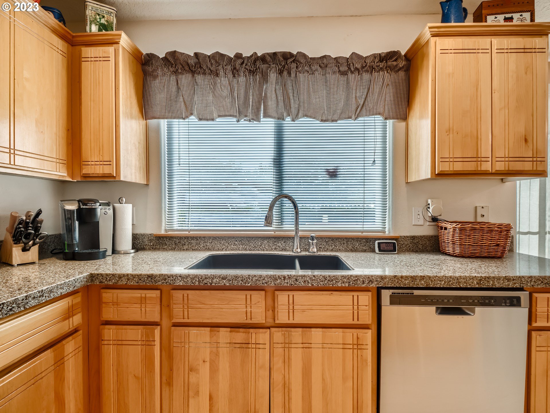 1167 Southeast Eagle Lane Gresham, OR 97080 - Photo 5 of 25 a kitchen with granite countertop a sink and a stove