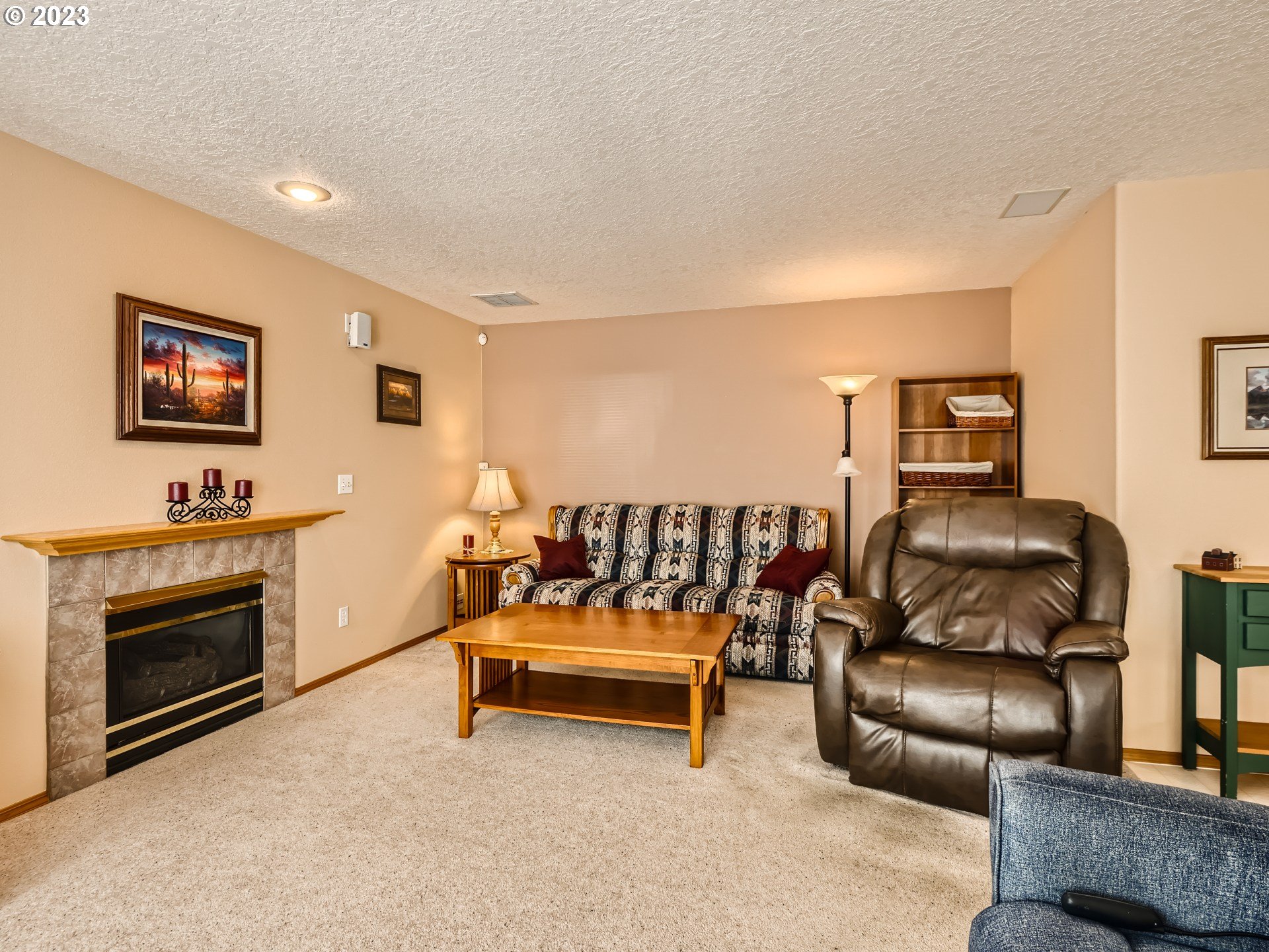 1167 Southeast Eagle Lane Gresham, OR 97080 - Photo 9 of 25 a living room with furniture and a fireplace