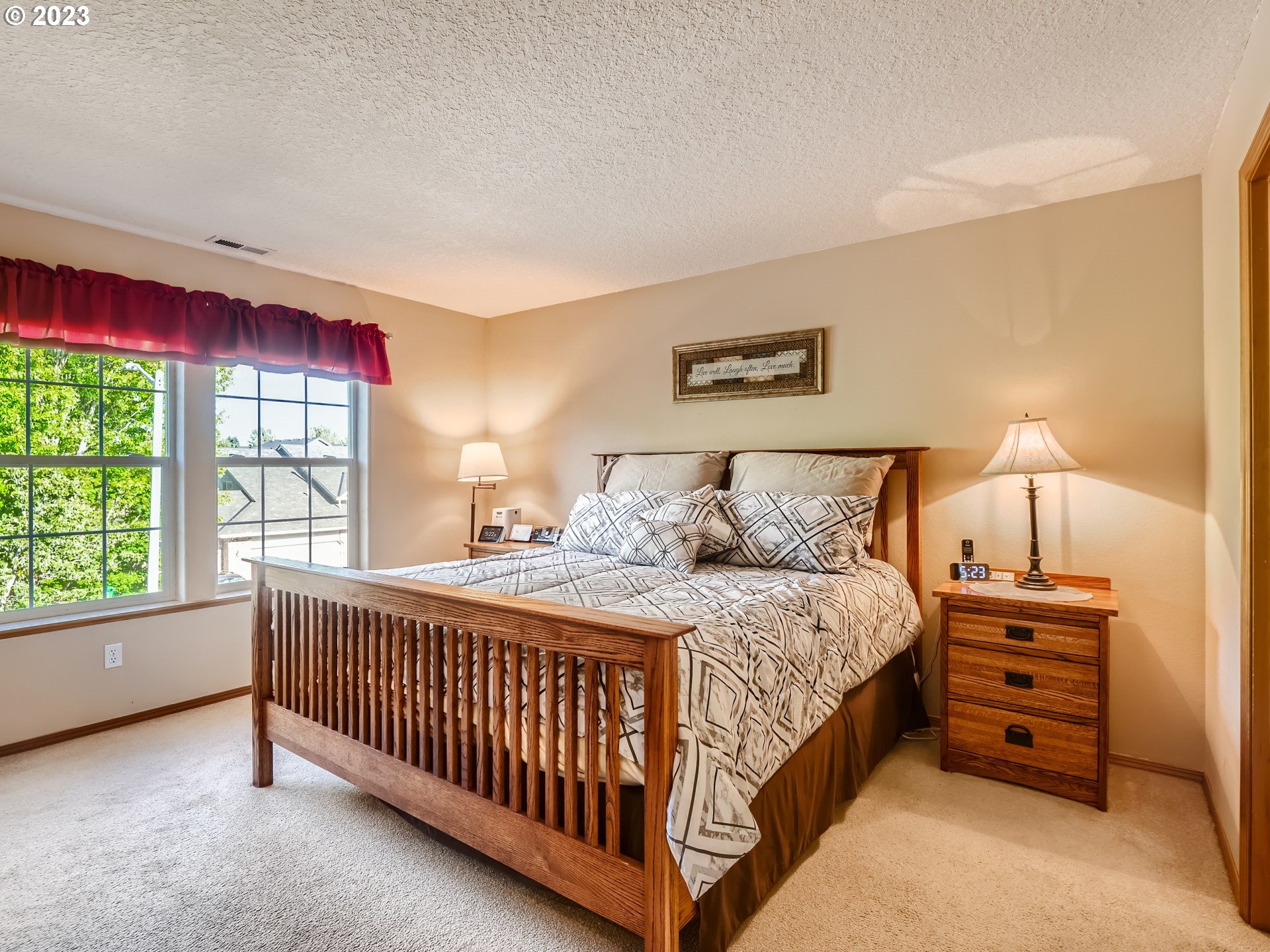 1167 Southeast Eagle Lane Gresham, OR 97080 - Photo 10 of 25 a bedroom with a bed and a window