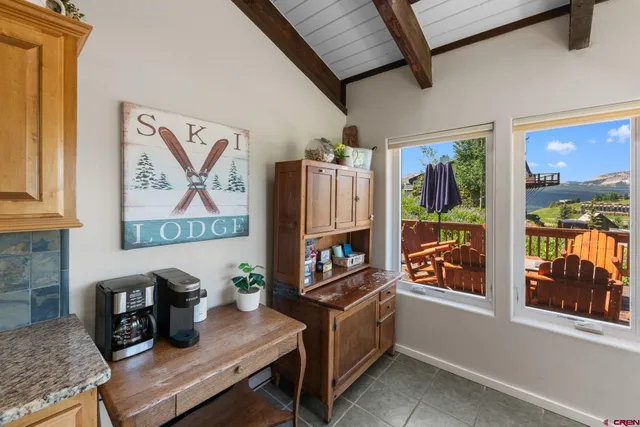 a workspace with furniture and window