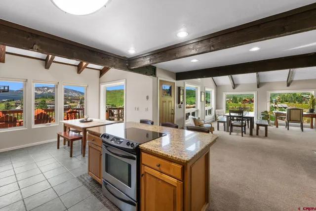 a kitchen with stainless steel appliances granite countertop a sink and cabinets