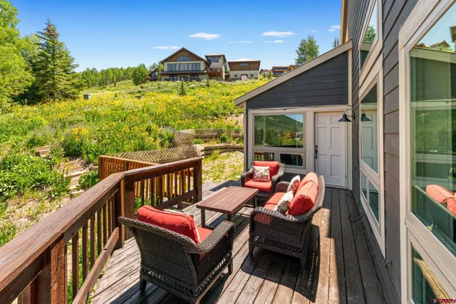 a view of a balcony with furniture