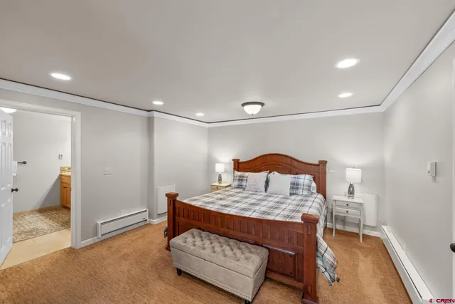 a living room with furniture and a dresser