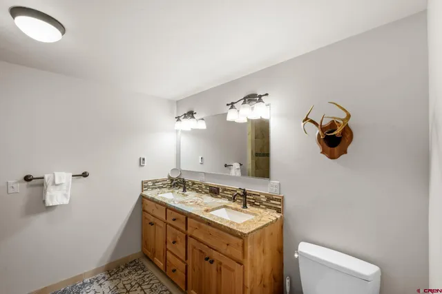 a bathroom with a sink and mirror