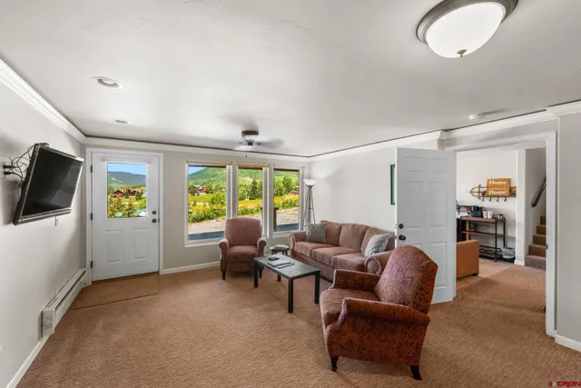 a living room with furniture and a large window