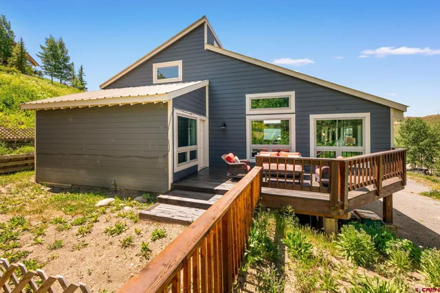 a view of two chairs in the balcony