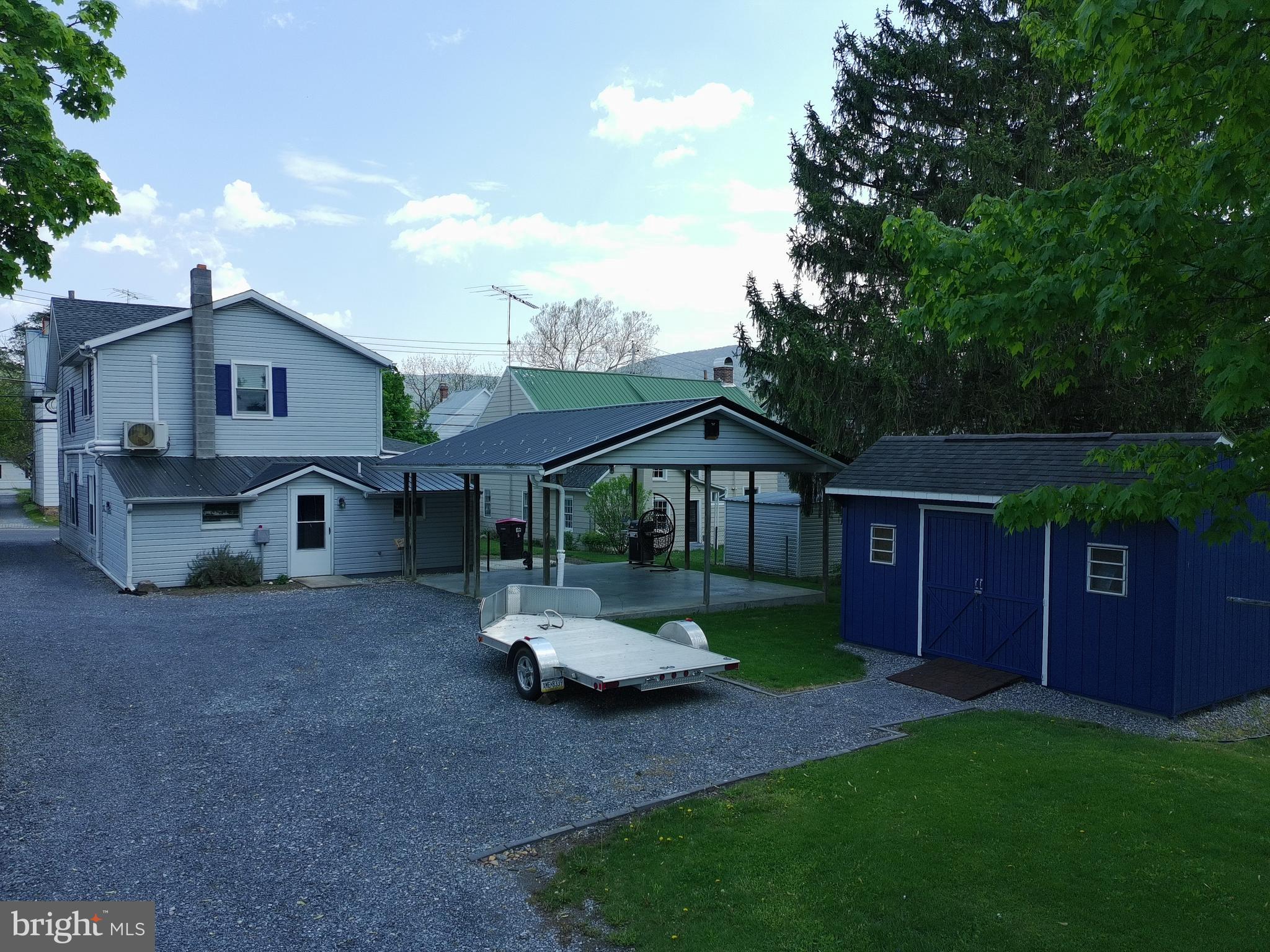 12997 Main Street Fort Loudon, PA 17224 - Photo 3 of 48 a front view of a house with garden