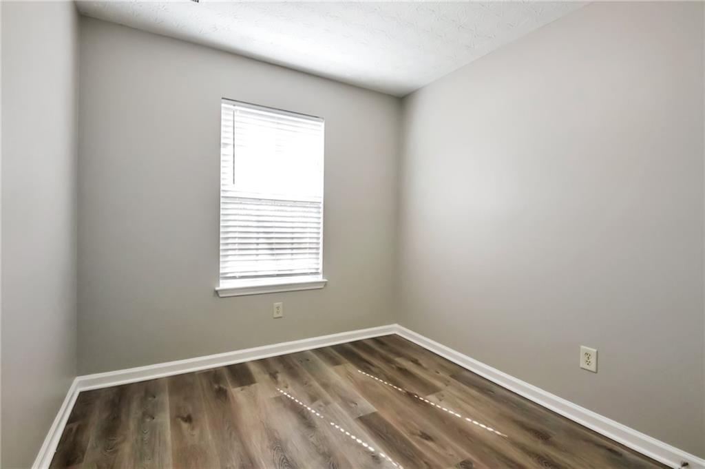 344 Springbottom Court Southeast Lawrenceville, GA 30046 - Photo 13 of 26 an empty room with a window