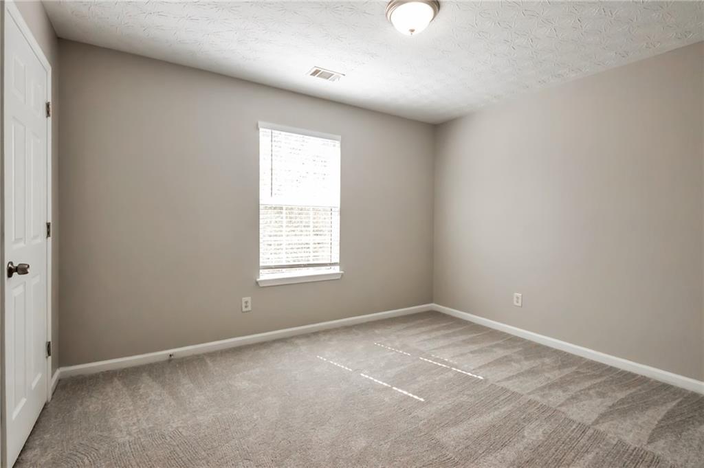 344 Springbottom Court Southeast Lawrenceville, GA 30046 - Photo 14 of 26 an empty room with a window