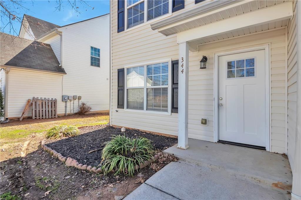 344 Springbottom Court Southeast Lawrenceville, GA 30046 - Photo 2 of 26 a view of a house with a yard