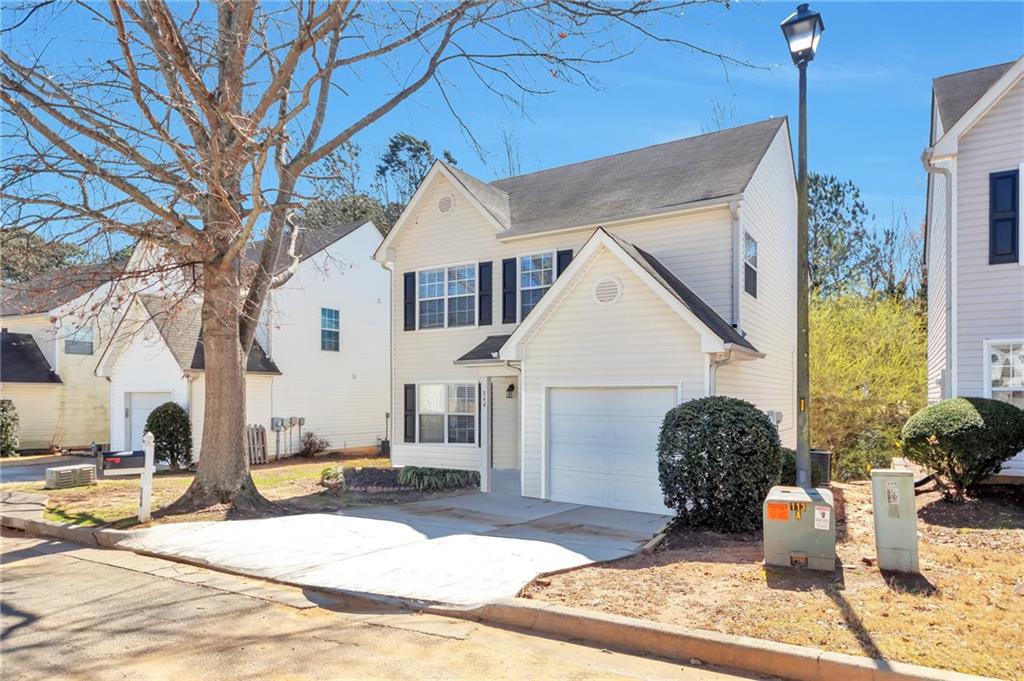 344 Springbottom Court Southeast Lawrenceville, GA 30046 - Photo 26 of 26 a view of a white house with a outdoor space