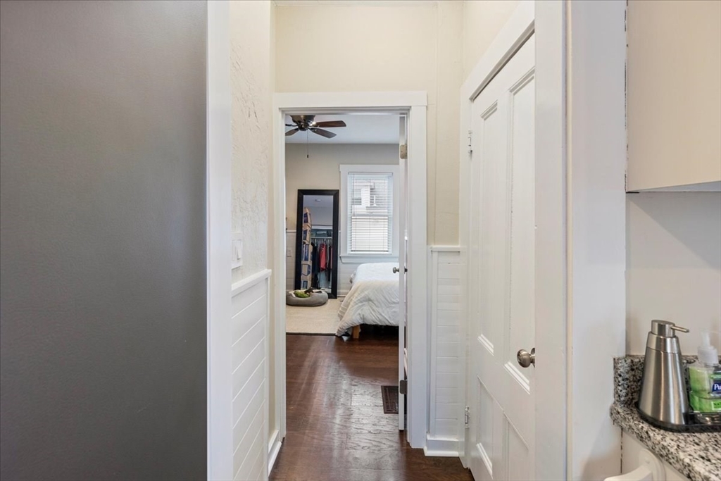 64 Parker Street Maynard, MA 01754 - Photo 15 of 39 a view of a bedroom with a bed and wooden floor
