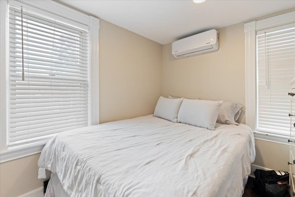64 Parker Street Maynard, MA 01754 - Photo 16 of 39 a bedroom with a bed and a window
