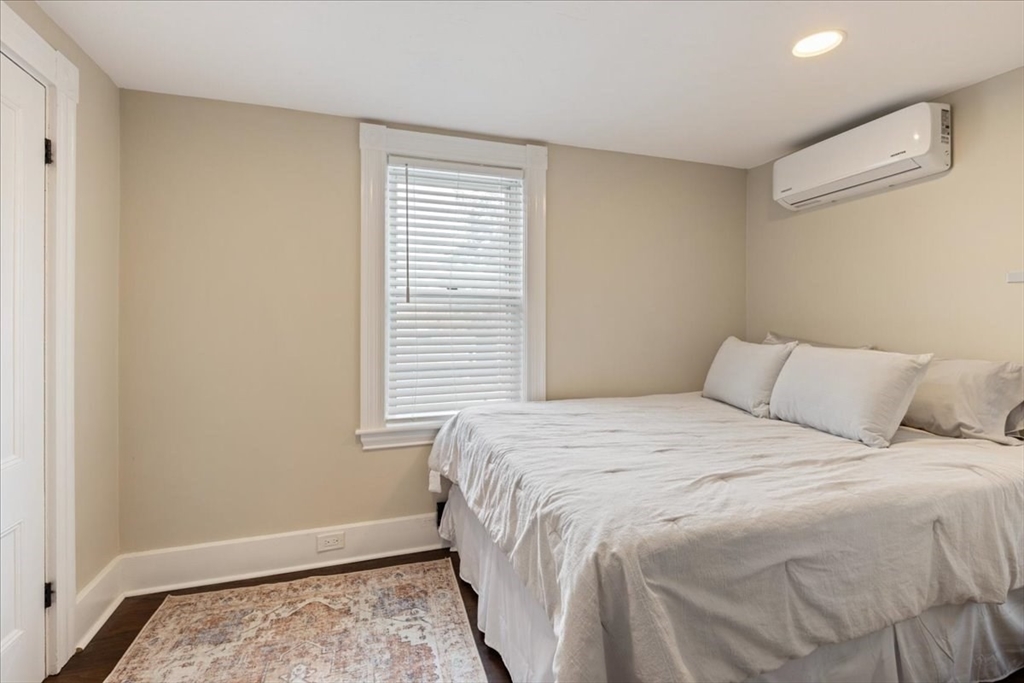 64 Parker Street Maynard, MA 01754 - Photo 17 of 39 a large bed in a bedroom next to a window