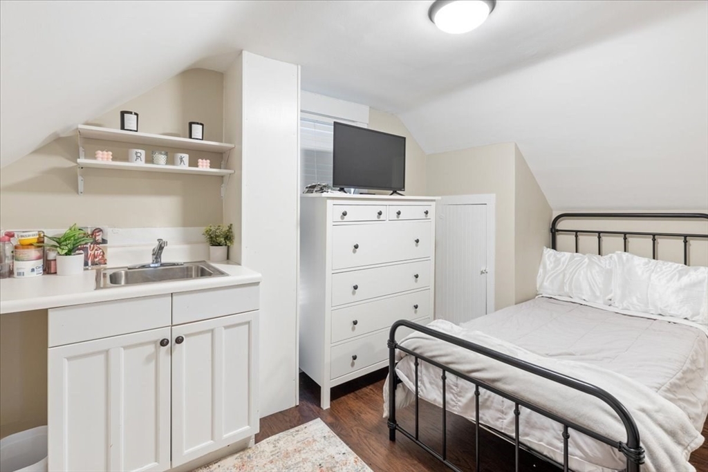 64 Parker Street Maynard, MA 01754 - Photo 20 of 39 a bedroom with a bed and flat screen tv