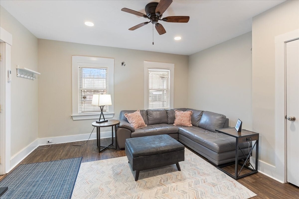 64 Parker Street Maynard, MA 01754 - Photo 2 of 39 a living room with furniture and a window