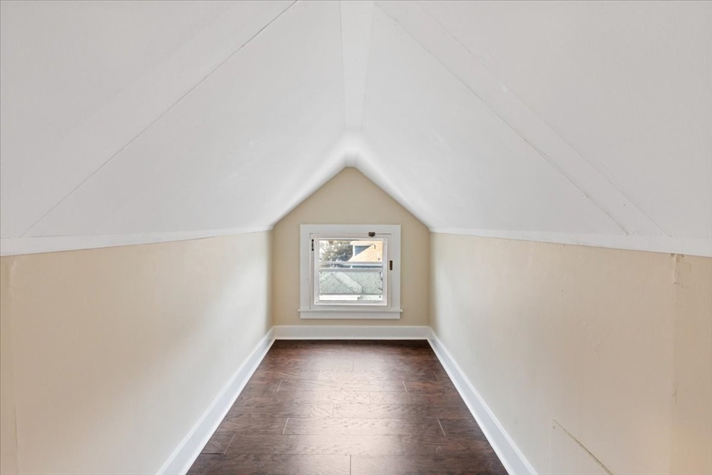 64 Parker Street Maynard, MA 01754 - Photo 23 of 39 wooden floor in an empty room with a window