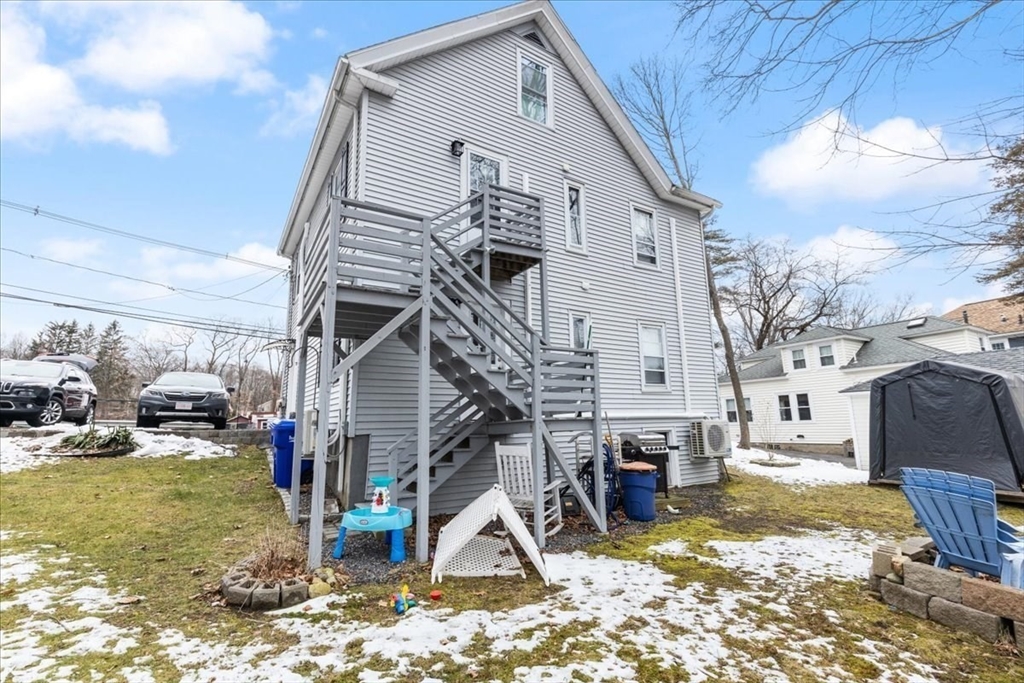 64 Parker Street Maynard, MA 01754 - Photo 26 of 39 a view of a house with a snow