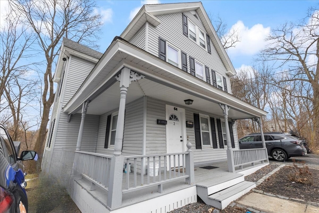 64 Parker Street Maynard, MA 01754 - Photo 27 of 39 a view of a white house with large windows