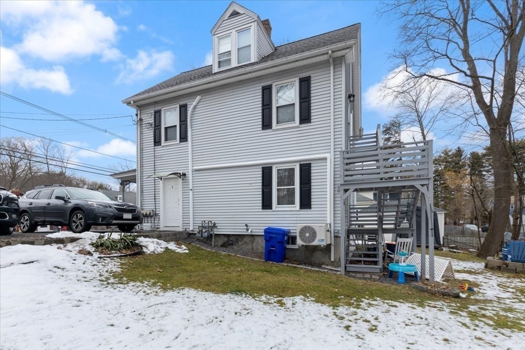 64 Parker Street Maynard, MA 01754 - Photo 29 of 39 a view of a house with a patio