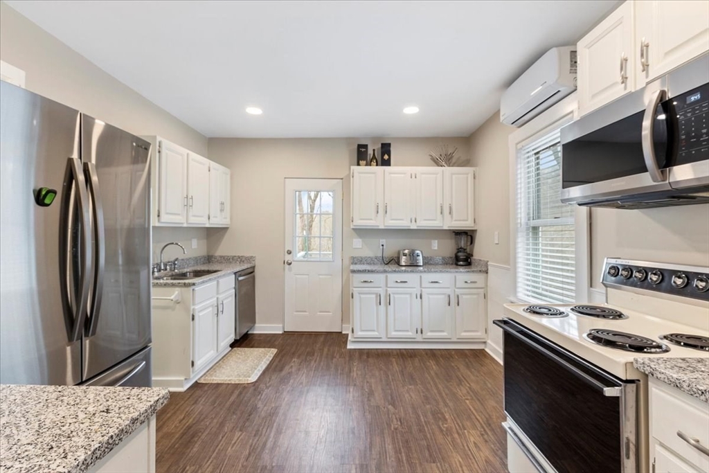 64 Parker Street Maynard, MA 01754 - Photo 3 of 39 a kitchen with granite countertop a refrigerator stove and sink