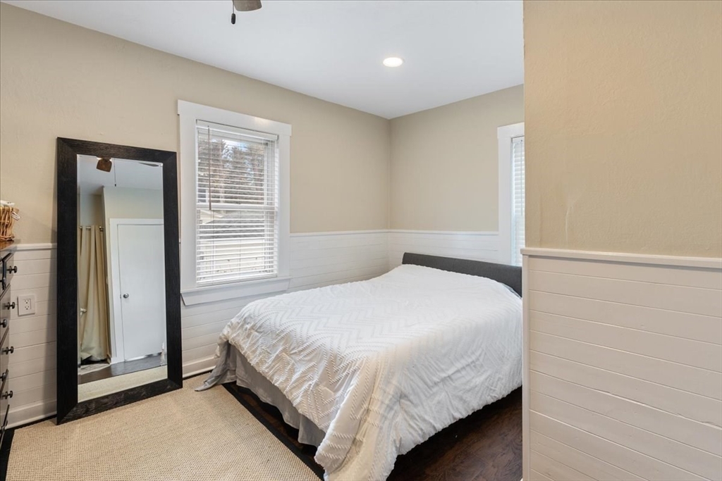 64 Parker Street Maynard, MA 01754 - Photo 6 of 39 a bedroom with a bed and a window