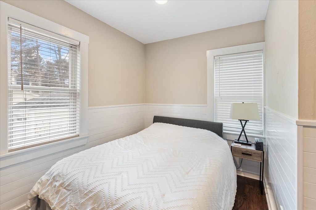 64 Parker Street Maynard, MA 01754 - Photo 7 of 39 a bedroom with a bed and a window