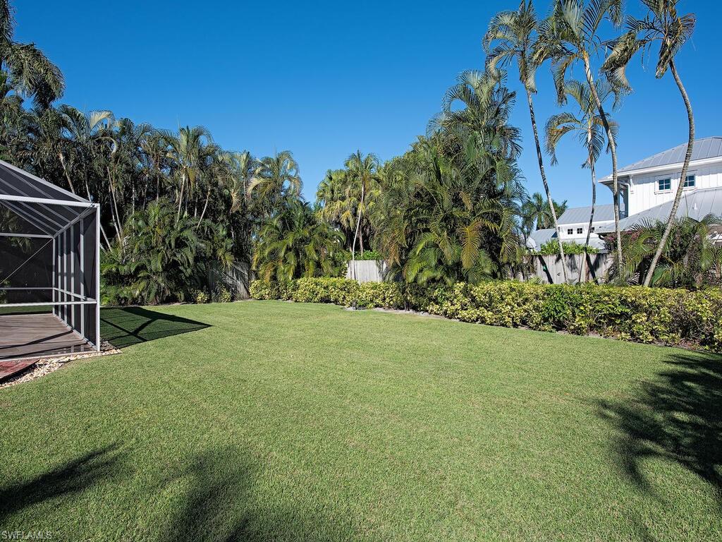 271 1st Avenue South Naples, FL 34102 - Photo 8 of 14 a view of a backyard