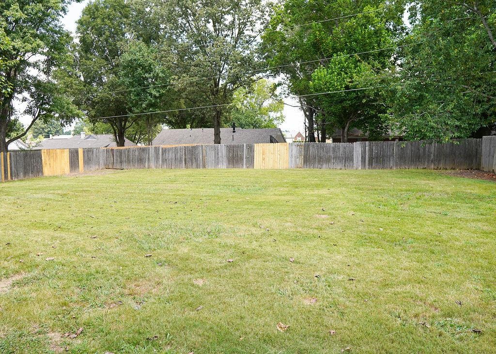 5488 Ross Road Memphis, TN 38141 - Photo 18 of 18 a view of a house with a yard and sitting area