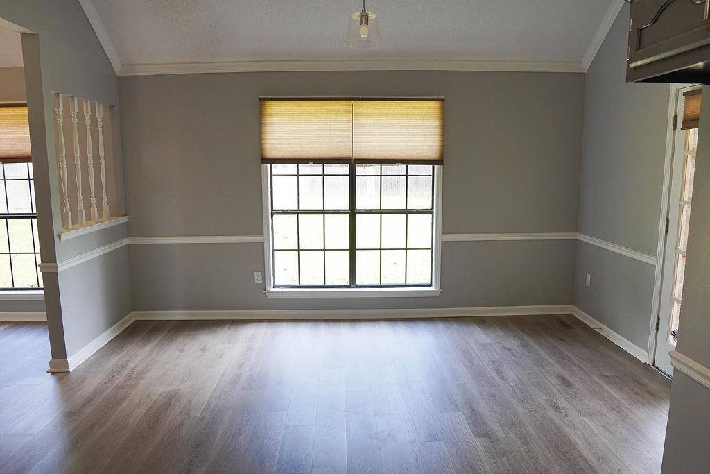 5488 Ross Road Memphis, TN 38141 - Photo 6 of 18 an empty room with wooden floor and windows