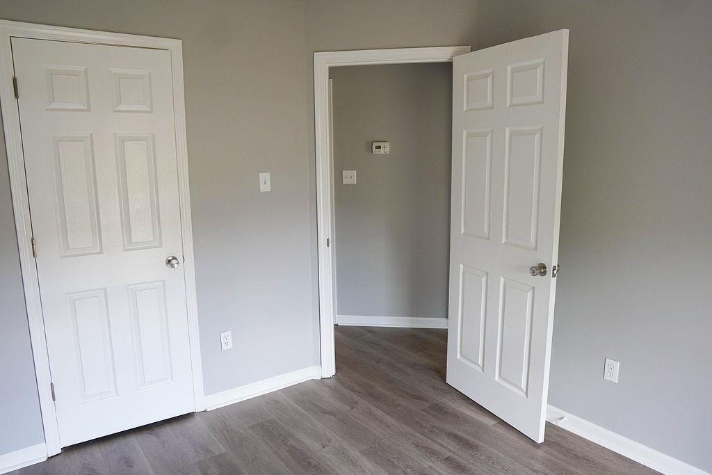 5488 Ross Road Memphis, TN 38141 - Photo 9 of 18 a view of a hallway with wooden floor